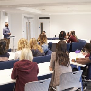 University students study in a classroom with male lecturer